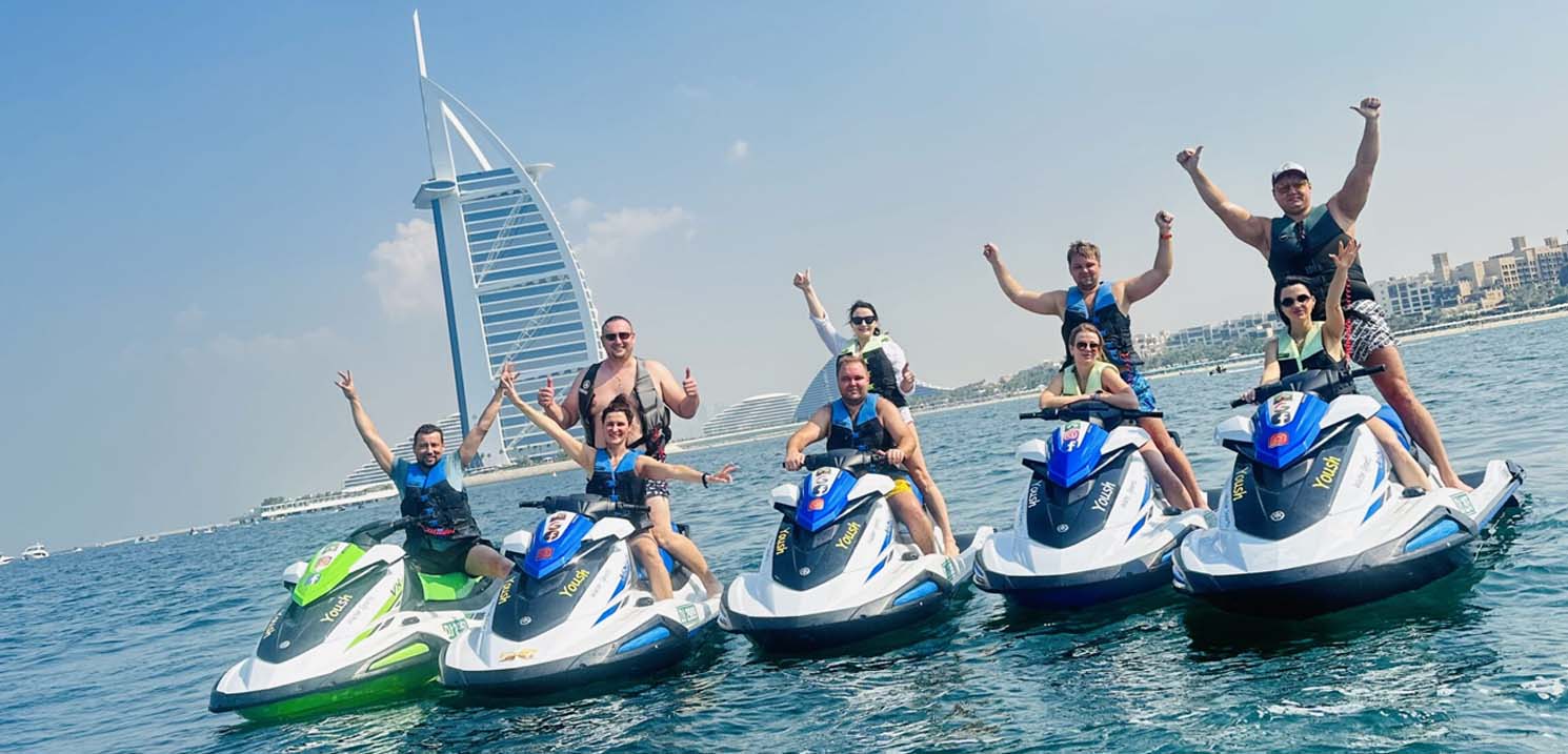 Top 10 Outdoor Activities to Do in June 2024 - Tourists Enjoying Jet Ski on Burj Arab Front