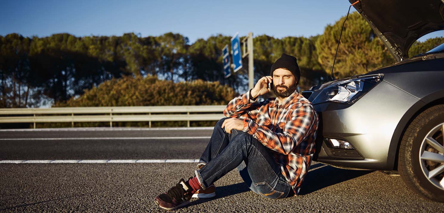 How to Report an Accident in Dubai - Man Calling for Help after Road Accident