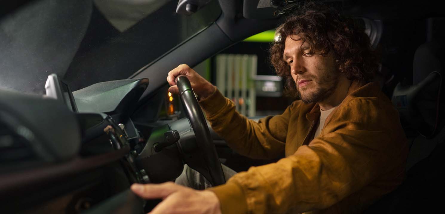 Serious Consequences of Drinking and Driving in Dubai - Man Driving & Drinking